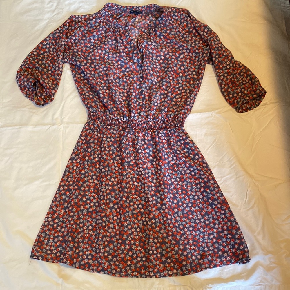 Light weight floral dress with elastic waist.
